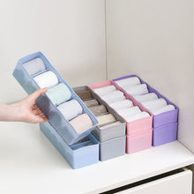 Plastic organizer with dividers, perfect for sorting beads and other small items.