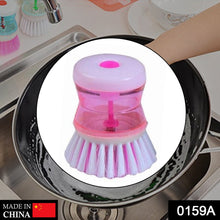 Kitchen cleaning brush with liquid soap dispenser for convenience