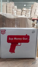 Money gun on table